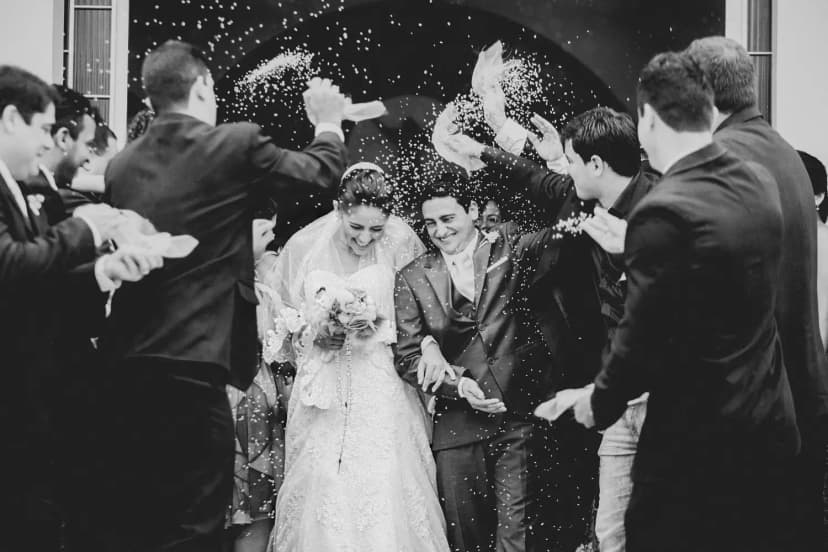 Wedding couple celebrating with confetti